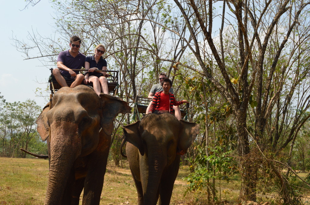 Shannon, Stephen and Derrick riding elephants in Kanchanaburi, Thailand
