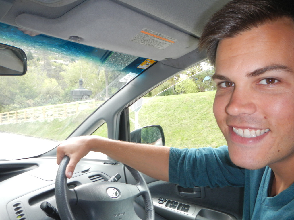 Stephen in the Driver's seat of a Jucy Van in New Zealand