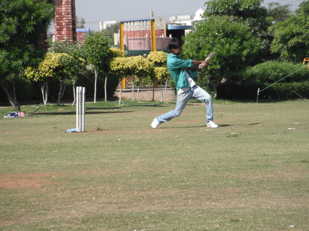 Vipul swinging a cricket bat